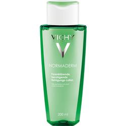 Grüne Flasche mit Reinigungs-Lotion, geeignet für empfindliche Haut.